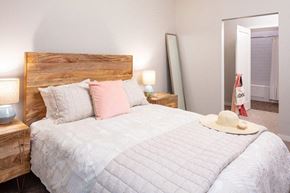 Edina apartment for rent - a bedroom with a bed and a hat on top of it