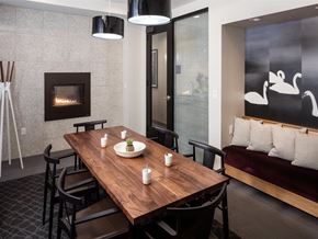 Minneapolis apartment for rent - a dining room with a table and chairs and a fireplace