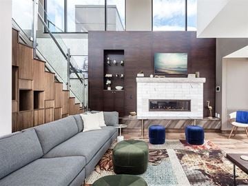 Minneapolis apartment for rent - a living room with a gray couch and a fireplace