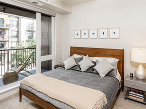 Minneapolis apartment for rent - a bedroom with a bed and a large window