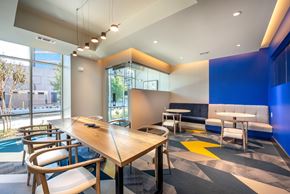 Dallas apartment for rent - A conference room with a long table and chairs.