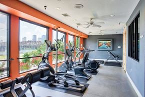 North Little Rock apartment for rent - Apartments for Rent in North Little Rock, AR 72114– Metropolitan-   A fitness center with cardio equipment and glass windows in front of them
