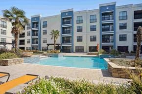 North Little Rock apartment for rent - Apartments for Rent in North Little Rock, AR 72114– Metropolitan-   A pool surrounded by a patio and a building.