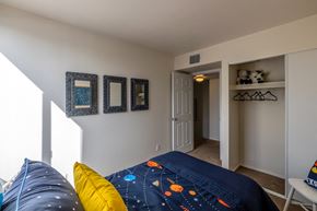 Tucson apartment for rent - Bedroom with large closet and window at Midtown on Seneca, a pet-friendly apartment community near East Central Tucson, Tucson, AZ.