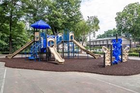 Clarkston apartment for rent - Colorful playground with slides and swings at Mirador at Idlewood Apartments near Stone Mountain and Kirkwood