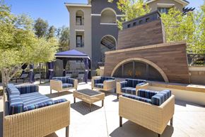 Las Vegas apartment for rent - a lounge area with couches and chairs in front of a fireplace