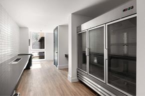 Houston apartment for rent - A modern kitchen with a large oven and a tiled wall.