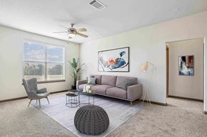 Bentonville apartment for rent - Apartments for Rent in Bentonville, AR 72713– Parc at Bentonville -   Living Room with ceiling fan and large windows