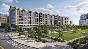 Dallas apartment for rent - A modern building with a green lawn in front.