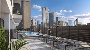Dallas apartment for rent - A rooftop pool with a view of the city skyline.