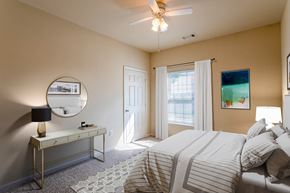 Clarksville apartment for rent - Apartments in Clarksville, TN for Rent - Parc at Clarksville - bedroom with ceiling fan and large window with curtains
