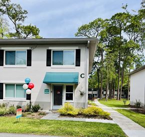 Gainesville apartment for rent - the front of a building with balloons outside of it