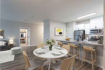 Sherwood apartment for rent - a living room and kitchen with a white table and chairs