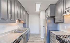 El Cajon apartment for rent - Three BR Apartments in El Cajon CA - Ivanhoe Village - Kitchen with Light Grey Countertops, Grey Cabinets, and Black and Silver Appliances