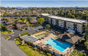 El Cajon apartment for rent - Apartments for Rent in El Cajon CA - Ivanhoe Village - Aerial View of Outdoor Amenities Including the Pool, Basketball Court, and Horse Shoes as Well as the Apartment Building and Parking Lot