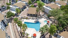 Tucson apartment for rent - a aerial view of a swimming pool and a house
