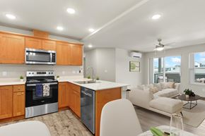 Vancouver apartment for rent - A modern kitchen with wooden cabinets and stainless steel appliances.