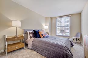 San Rafael apartment for rent - San Rafael, CA, Apartments Near Mount Tamalpais State Park - Rafael Town Center - Spacious Bedroom With Plush Carpeting, BEd, Nightstands with Lamps, Dresser, Chair, And Large Picture Window With Blinds.
