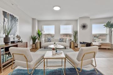 Des Plaines apartment for rent - A living room with a white sofa and a coffee table.
