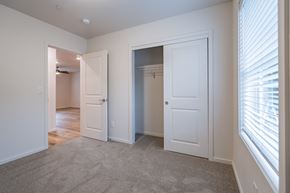 Vancouver apartment for rent - a bedroom with two closets and a window