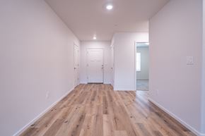 Vancouver apartment for rent - a bedroom with hardwood floors and white walls