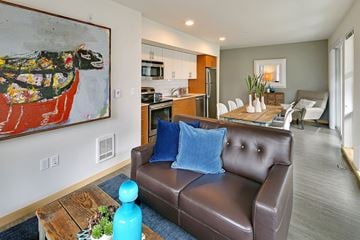 Seattle apartment for rent - a living room with a leather couch and a coffee table