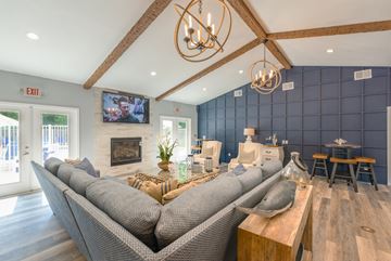 Salisbury apartment for rent - A modern living room with a grey sofa and a wooden coffee table.
