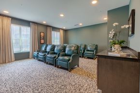 Norcross apartment for rent - Resident media lounge with comfortable theater seating at Sage 5430, a welcoming 55+ apartment community in Norcross, Georgia.