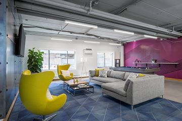 Minneapolis apartment for rent - a living room with yellow chairs and a couch