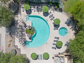 Surprise apartment for rent - Pet-Friendly Townhomes in Surprise, AZ - Sierra Verde - Pool with an Aerial View, Lounge Chairs, and a Jacuzzi