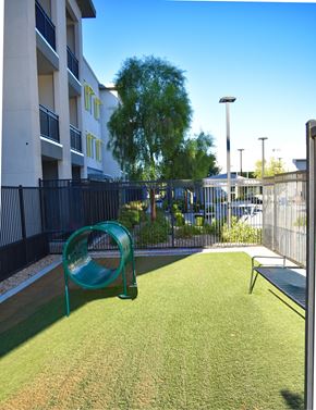 Las Vegas apartment for rent - A playground with a green slide and a bench.