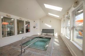 Bothell apartment for rent - A small indoor swimming pool with a glass enclosure.