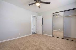 Milpitas apartment for rent - Apartments Milpitas - Spring Valley - Spacious Bedroom With High Ceilings, Ceiling Fan, Carpet Flooring, And Large Closet With Mirrors