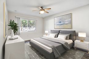 Gainesville apartment for rent - Bedroom with large window, natural light, and ceiling fan at Square One Apartments in Gainesville FL