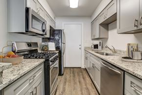 Gainesville apartment for rent - Kitchen with stainless steel appliances and ample cabinet space at Square One Apartments in Gainesville FL