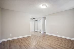 Fremont apartment for rent - One Bedroom Apartments in Fremont, CA - Lincoln Glen - An interior shot of the spacious living room, featuring hardwood flooring & a ceiling fan