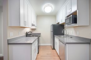 Fremont apartment for rent - 1 Bedroom Apartments in Fremont, CA - Lincoln Glen - An interior shot of the kitchen, featuring white cabinets and stainless steel appliances