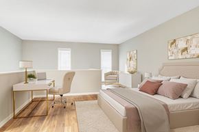 Stone Mountain apartment for rent - Affinitee at Stone Mountain Apartments photo of a bedroom with a bed and a desk with a chair