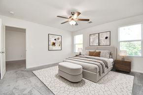 Houston apartment for rent - Houston, TX Single-Family Rental Homes - Imperial Forest - A Bedroom with Plush Carpet Flooring, a Ceiling Fan, and Two Wooden Nightstands with Lamps.