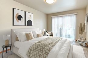 Seattle apartment for rent - a bedroom with a large bed and a window