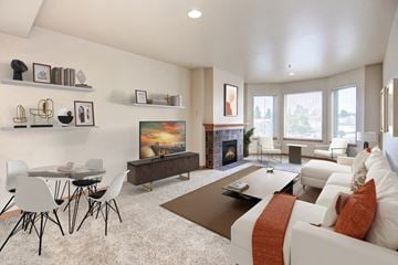 Seattle apartment for rent - a living room with a couch and a table