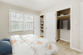 Raleigh apartment for rent - a bedroom with a bed and a closet