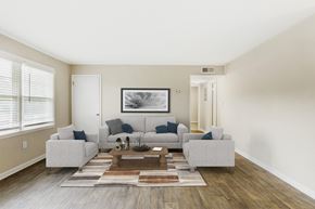Raleigh apartment for rent - a living room with a couch and a coffee table