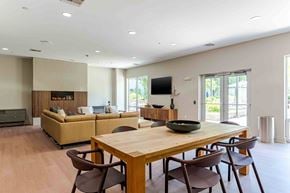 Stamford apartment for rent - A modern dining room with a wooden table and chairs.