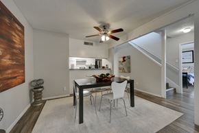 San Antonio apartment for rent - a dining area with a table and chairs and a ceiling fan