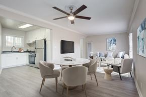 Carlsbad apartment for rent - A modern dining room with a white table and chairs.