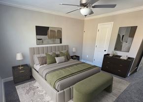Parkville apartment for rent - A bedroom with a large bed and a ceiling fan.
