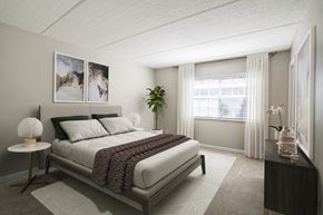 Jacksonville apartment for rent - Bedroom with plush carpet, large window, and good natural lighting at Townsend Apartments in Jacksonville near Atlantic Beach, Florida
