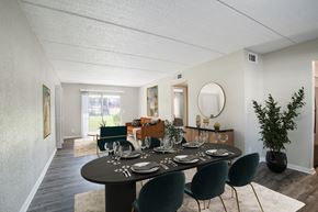 Jacksonville apartment for rent - Dining room next to living room with large window and sliding door at Townsend Apartments in Jacksonville near Atlantic Beach, Florida.