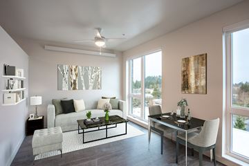 Portland apartment for rent - a living room with a couch and a table and a large window